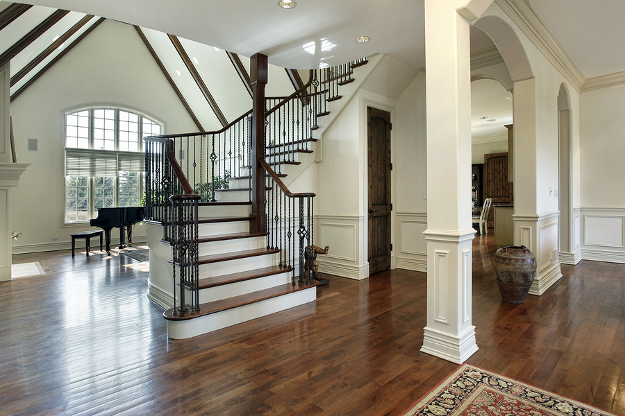 Updated staircase with dark hardwoods and iron spindles